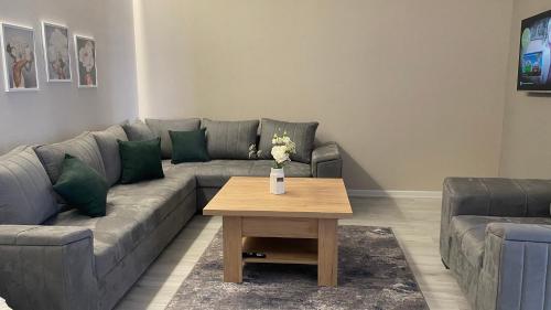 a living room with a couch and a coffee table at Your Sweet Home Gyumri in Gyumri