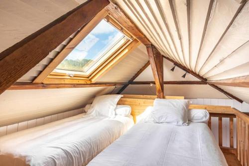 En eller flere senge i et værelse på La Maison de Jade - Etretat Centre - 6 pers