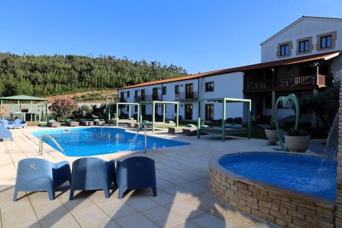a resort with a swimming pool and a building at Valonquinta - Agro Hotel & SPA in Vila Flor