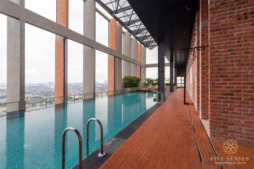 a large swimming pool on top of a building at Millerz Square Bangsar KL, Five Senses in Kuala Lumpur