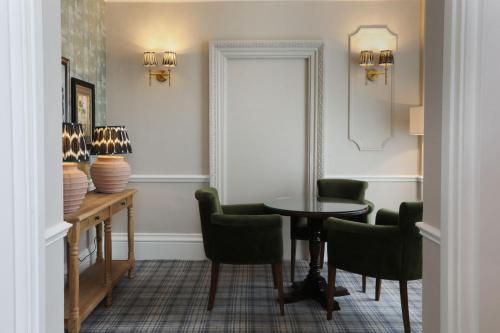 a room with a table and chairs and a window at The Harrogate Inn - The Inn Collection Group in Harrogate