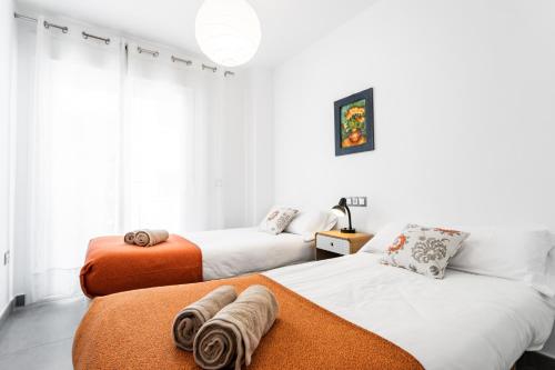 Säng eller sängar i ett rum på Sur Suites La Dorada 3