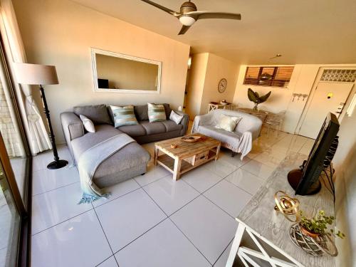 a living room with a couch and a table at 503 Hawaan View in Durban