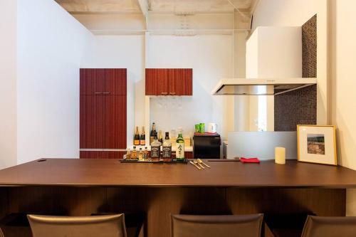 a kitchen with a large wooden counter top in a room at MS STUDIO in Asahikawa