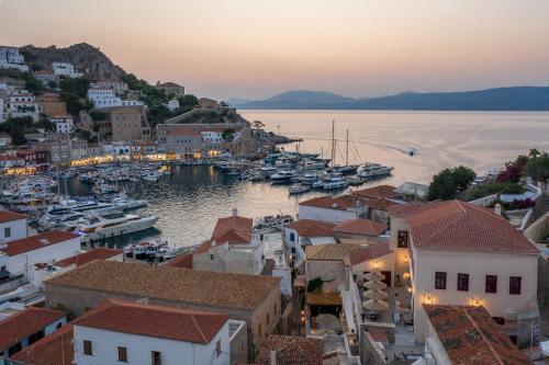 a view of a harbor with boats in the water at FOS Hydra residence in Hydra
