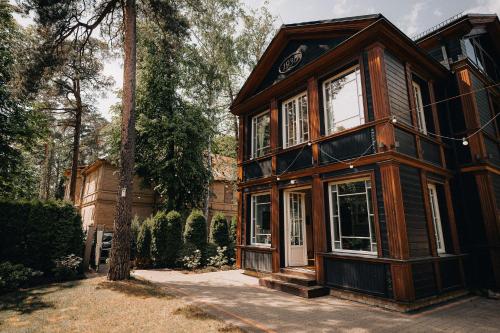 a house that is sitting in the yard at Exquisite 1930's Historical House in Jūrmala