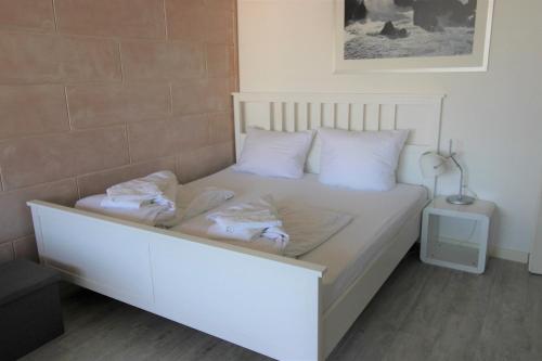 Postel nebo postele na pokoji v ubytování Meerzeit N-9-11