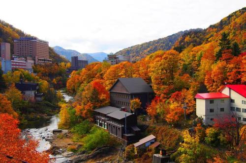 an autumn view of a town and a river at MS STUDIO in Asahikawa