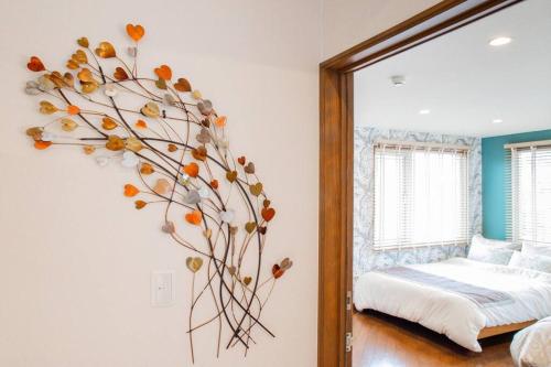 a large mirror in a bedroom with a plant on the wall at THE BLAUBAUM TOYA in Lake Toya