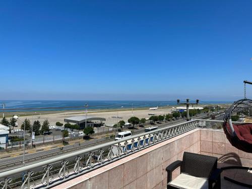 a balcony with a view of a highway and the ocean at KARTAL APART in Pelitli
