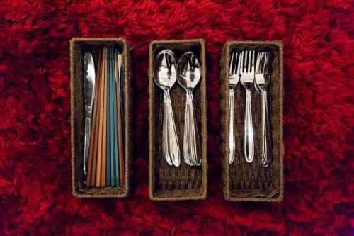 a group of utensils sitting on a red blanket at MS STUDIO in Asahikawa
