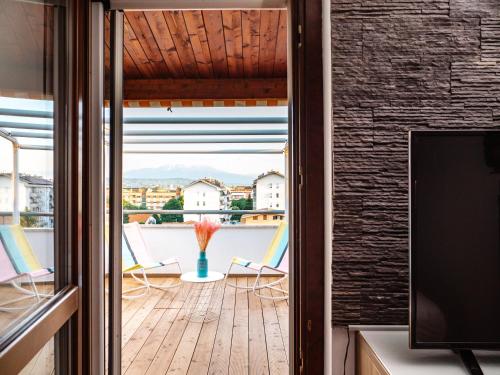 a room with a view of a balcony with chairs at Minià in Pescara