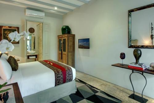 Ένα ή περισσότερα κρεβάτια σε δωμάτιο στο Room & Vespa 3 - Relaxing Stay Center Seminyak