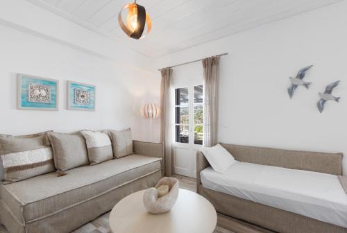 A bed or beds in a room at Erifili Houses