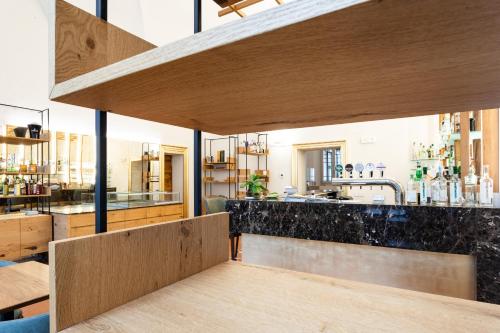 a kitchen with wooden countertops and a counter top at Cà Uberti Home Boutique, MantegnaHotels in Mantova
