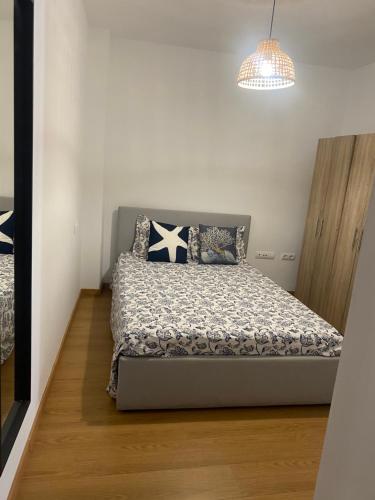Ένα ή περισσότερα κρεβάτια σε δωμάτιο στο Apartamento Punta Umbría junto a la Ría