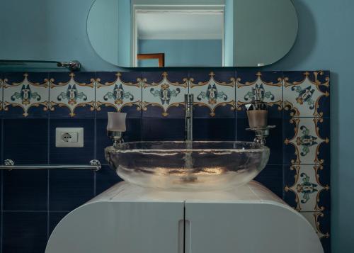 a bathroom with a sink and a mirror at Casa Caracciolo in Pitigliano