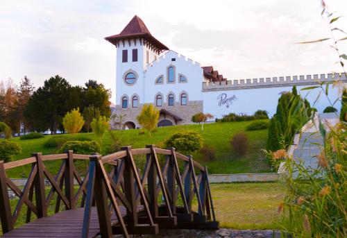 a building on a hill with a wooden bridge at Chateau Purcari in Purcari