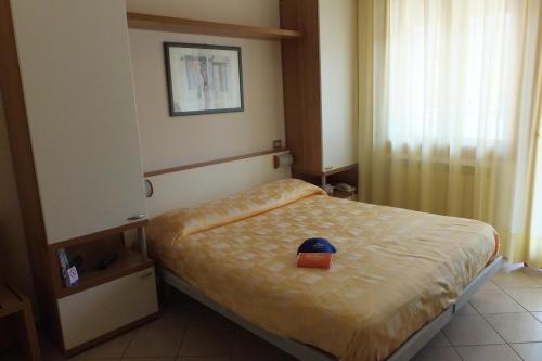 מיטה או מיטות בחדר ב-Hotel Nettuno