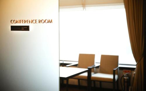 a conference room with chairs and a sign that reads conference room at Lotte Hotel Ulsan in Ulsan