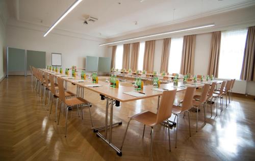 a large conference room with a long table and chairs at Cityhotel D&C St.Pölten in Sankt Pölten