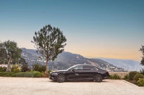 a black car parked on the side of a road at The Maybourne Riviera, Maybourne in Roquebrune-Cap-Martin