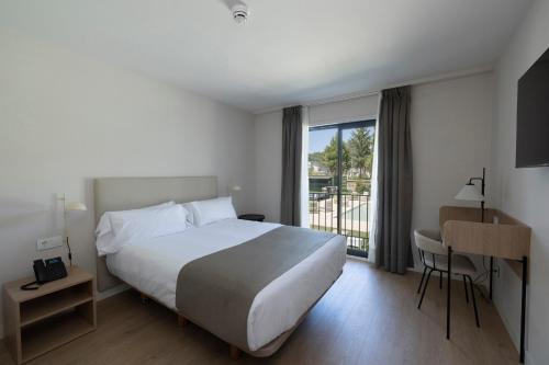 Postel nebo postele na pokoji v ubytování Hotel H4 Cangas 3 Superior