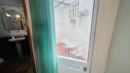 a view of a bathroom with a sink and a window at Apartamento Jimena Cadiz en el centro de Nerja in Nerja