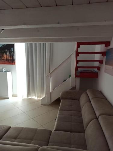 a living room with a couch and a chair at Enjoy Trani in Trani