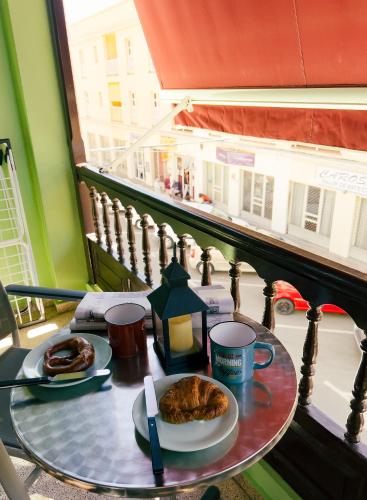 a table with a plate of food on a balcony at Apartamentos Mesa in Valle Gran Rey