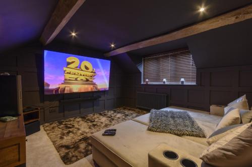 a bedroom with a big screen tv in a room at Ketley Vallens in Telford