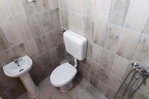 a bathroom with a toilet and a sink at Vucja Gora in Foča