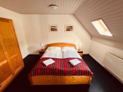 a bedroom with a bed in a attic at Chata U Skota in Janov nad Nisou