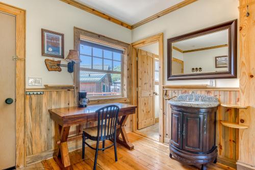 a room with a wooden table and a mirror at The Logs Bear Cave in Snowden