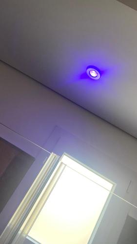 a ceiling with a purple light in a room at Grey House Guest House Luxury in Latina