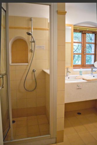 a bathroom with a shower and a sink at Bio Guesthouse Mani Sonnenlink in Pírgos