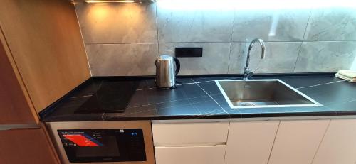 Nhà bếp/bếp nhỏ tại Sea Home Batumi Apartments