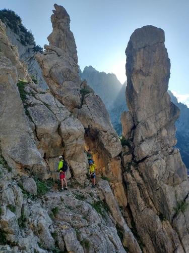 two people standing on the side of a rocky mountain at Oberachen Apartment in Ellmau