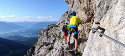 two people standing on the side of a mountain at Oberachen Apartment in Ellmau
