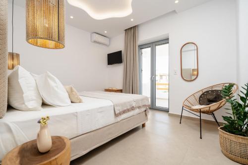 Ένα ή περισσότερα κρεβάτια σε δωμάτιο στο Nymphée Luxury Villas