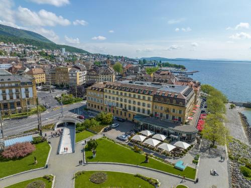 an aerial view of a city next to the water at Beau Rivage Hotel in Neuchâtel