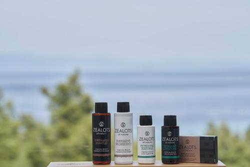 a group of four products sitting on a table at Mirabilia Boutique Hotel in Kriopigi