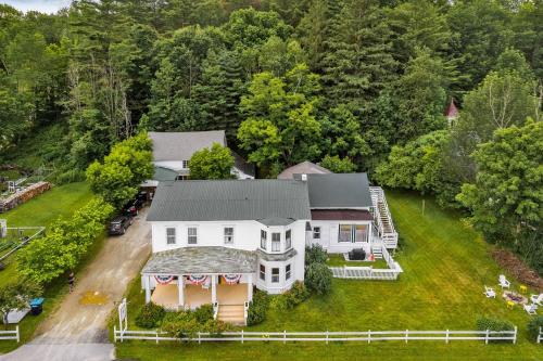 an aerial view of a large white house at 10 Min to Mountains Long Trail Suite in Bridgewater