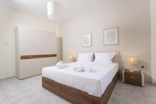 En eller flere senge i et værelse på Sea Breeze Villa