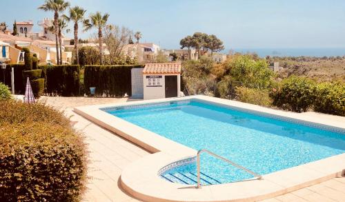 a swimming pool in the middle of a yard at VIP Alfaz del Pi in Alfaz del Pi