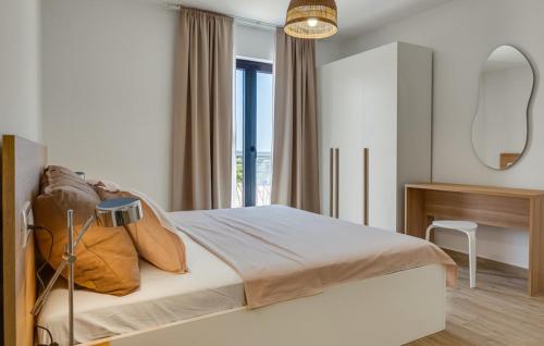 een slaapkamer met een bed en een groot raam bij Magnificent Villa Oasis with extra large pool in Vrana