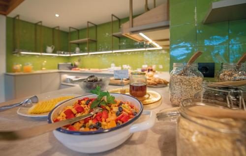 a kitchen with a bowl of food on a table at hubertus dolomites in Fiè