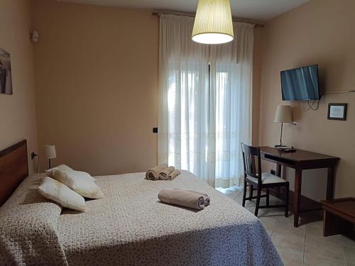 Ένα ή περισσότερα κρεβάτια σε δωμάτιο στο Villa Almelia