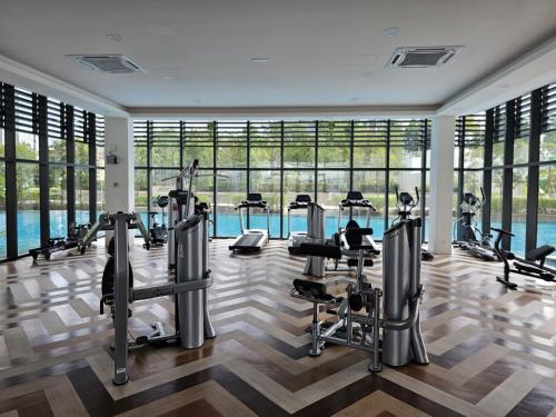 a gym with treadmills and cardio equipment in a building at NEW Sunway Greenfield Home 2-6pax 5mins to Sunway Pyramid in Petaling Jaya