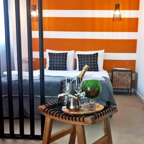 a room with a bed and a table with a table sidx sidx sidx at Casa do Ferreiro by Valada Village in Valada